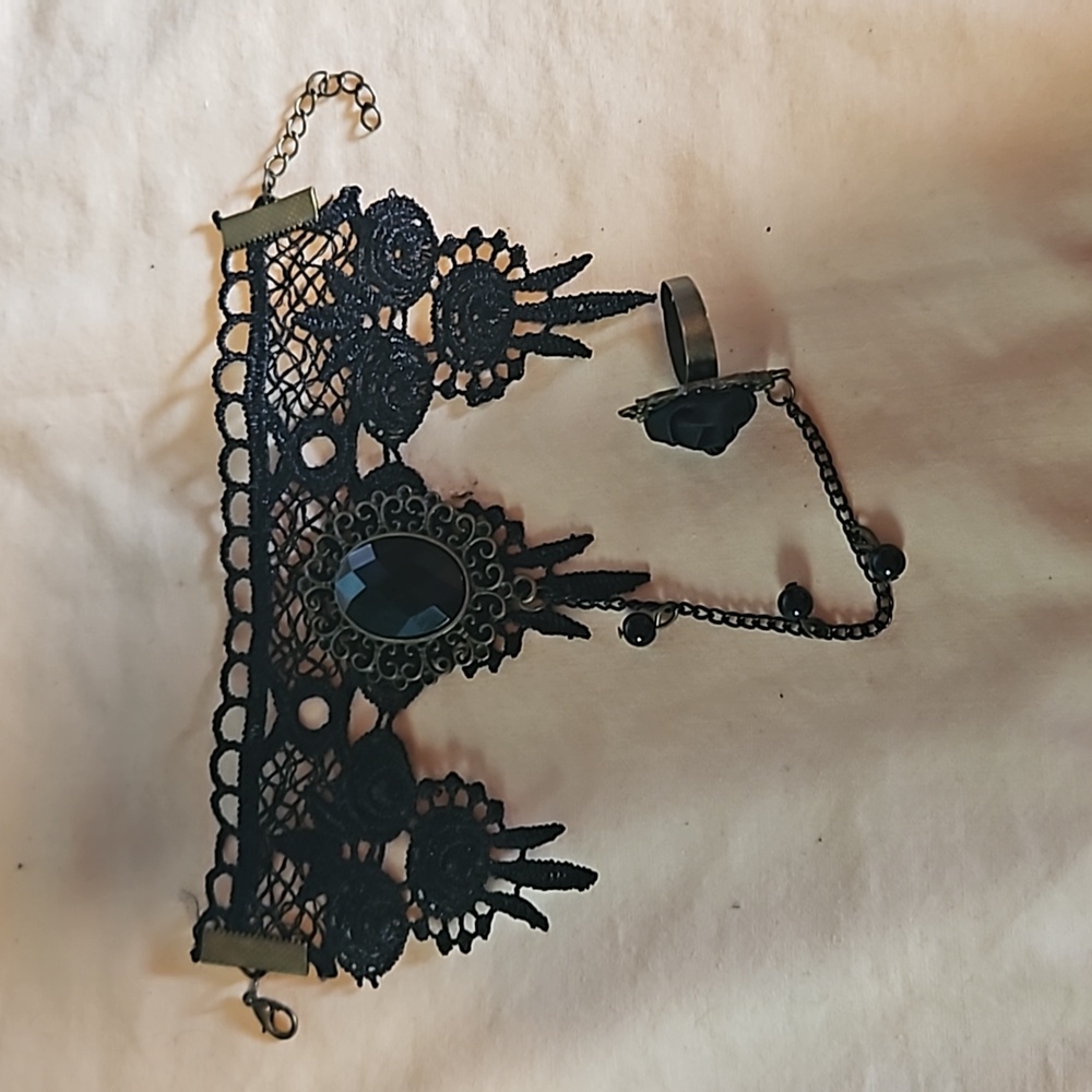 Wrist to ring bracelet black and brownish